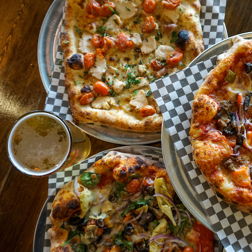 The Backyard with Neighbors Brew & Pies and Saw's BBQ Leeds in Leeds, AL